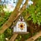 Glitzhome® 8.25" Distressed Metal Roof & Flower Wood Birdhouse